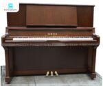 Đàn Piano Yamaha UX300Wn với lớp vỏ ngoài chế tác từ gỗ óc chó cao cấp, nổi bật bởi những đường vân gỗ tự nhiên