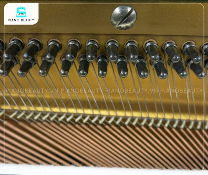 Trục giữ đây đàn piano cơ Yamaha U1E